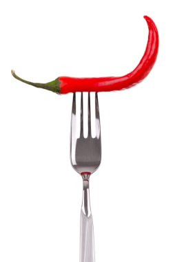 Red hot chili pepper pricked on the steel fork clipart