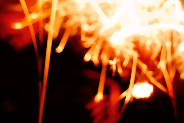 Blurred sparks on black background — Stock Photo, Image