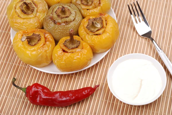 Serve from stuffed paprika on a mat — Stock Photo, Image