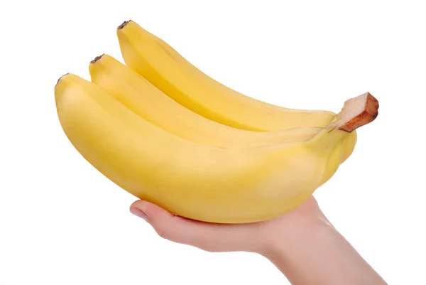 Bananenstrauß in der Hand einer Frau auf weißem Grund — Stockfoto