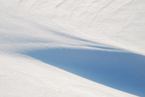 Hintergrund aus dem hell leuchtenden Schnee — Stockfoto