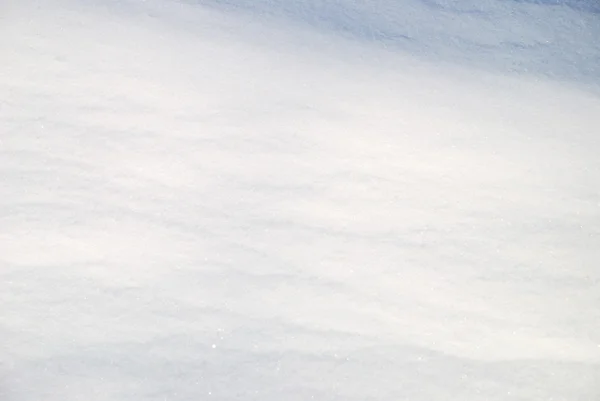 Pozadí z zářivě nablýskané sněhu — Stock fotografie
