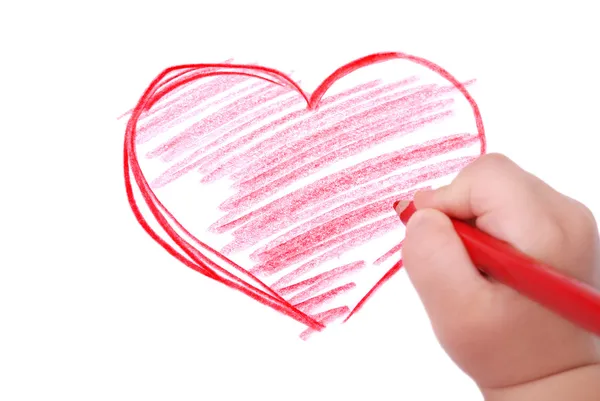 Childrens hand with pencil draws the heart — Stock Photo, Image