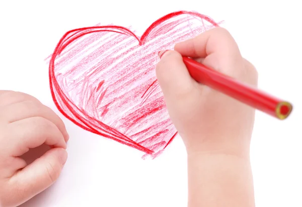 Childrens hand with pencil draws the heart — Stock Photo, Image