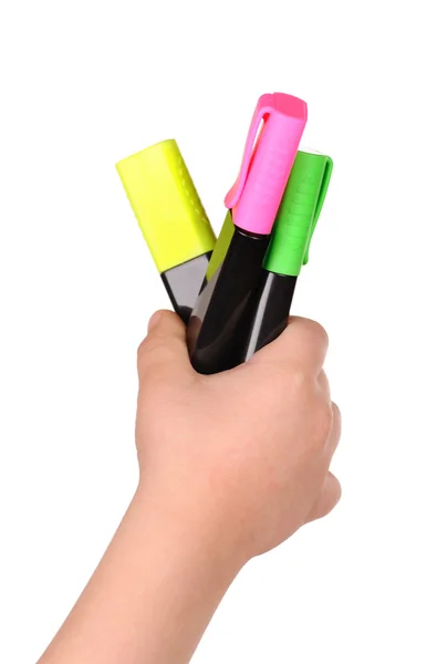 Children's hand holds the colorful markers — Stock Photo, Image