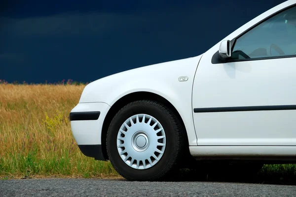 White car on the background field — Stock Photo, Image