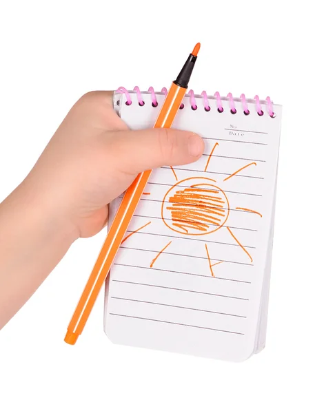 Children's hands hold notebook with a painted sun — Stock Photo, Image