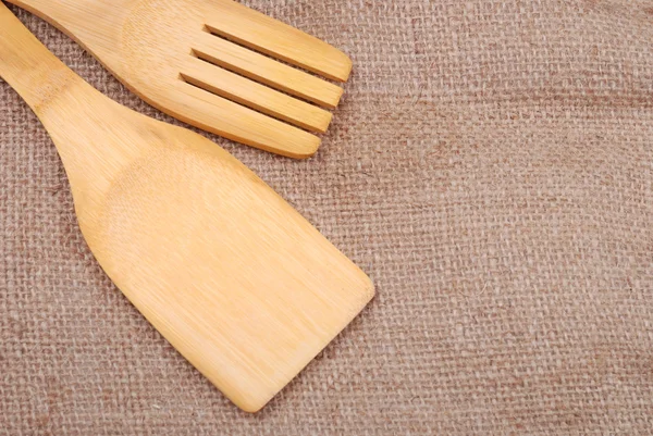 Wooden cooking utensils on a sackcloth — Stock Photo, Image
