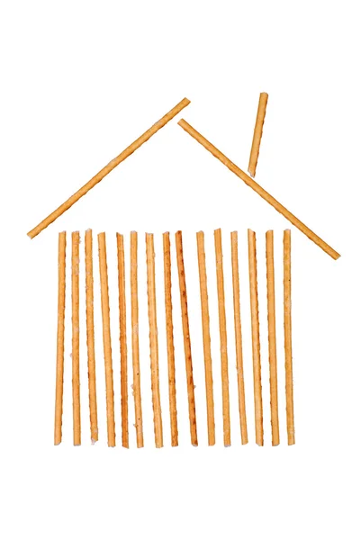 House symbol made from salted breadsticks — Stock Photo, Image