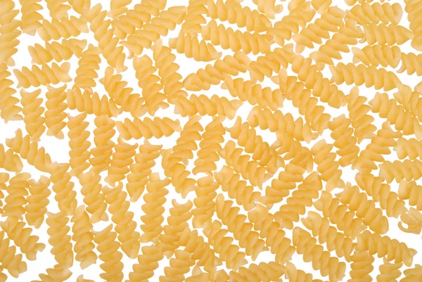 Syrové těstoviny ve formě spirály na bílém pozadí — Stock fotografie