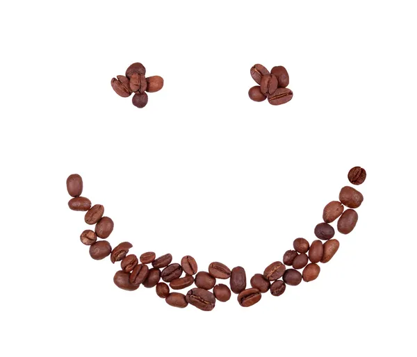 Kaffeekörner in Form eines lächelnden Gesichts — Stockfoto