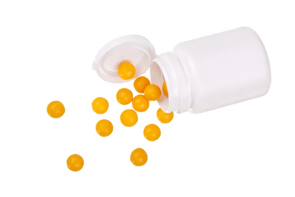 Tabletter i röret på vit — Stockfoto