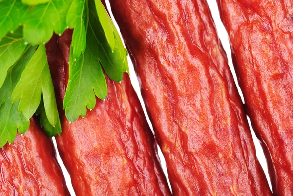Gruppo di gustose salsicce con prezzemolo — Foto Stock