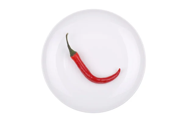 Red hot chili pepper on white dish — Stock Photo, Image