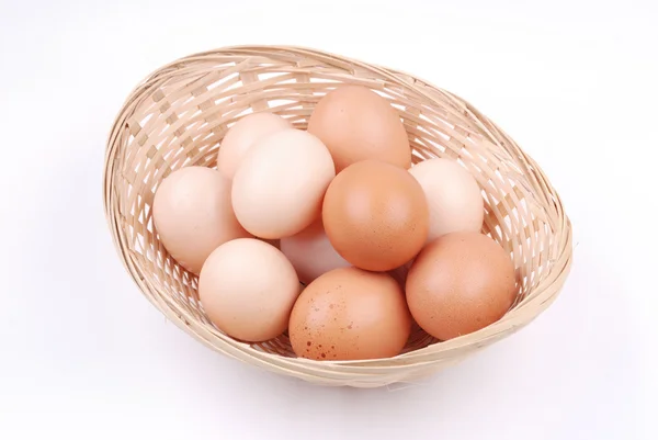 Basket with eggs on white — Stock Photo, Image