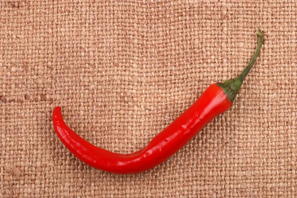 Red hot chili pepper on a sackcloth — Stock Photo, Image