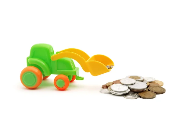 La excavadora de juguetes carga dinero —  Fotos de Stock