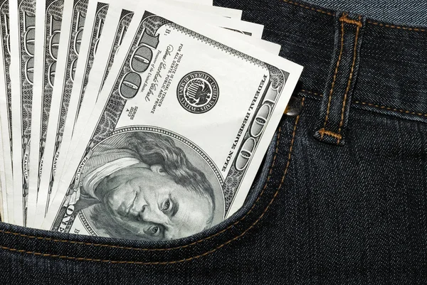 Jeans of which pocket stick out dollars — Stock Photo, Image