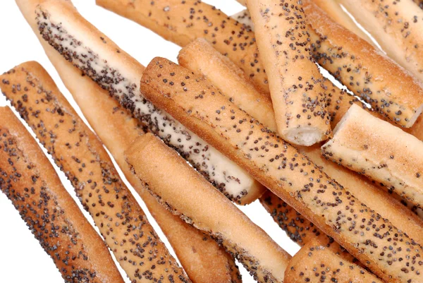 Tuzlu breadsticks ile üzerine beyaz izole haşhaş tohumu — Stok fotoğraf