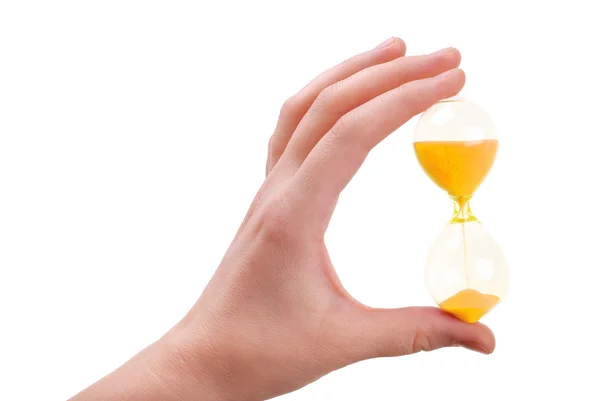 The female hand holds a sand-glass Stock Image