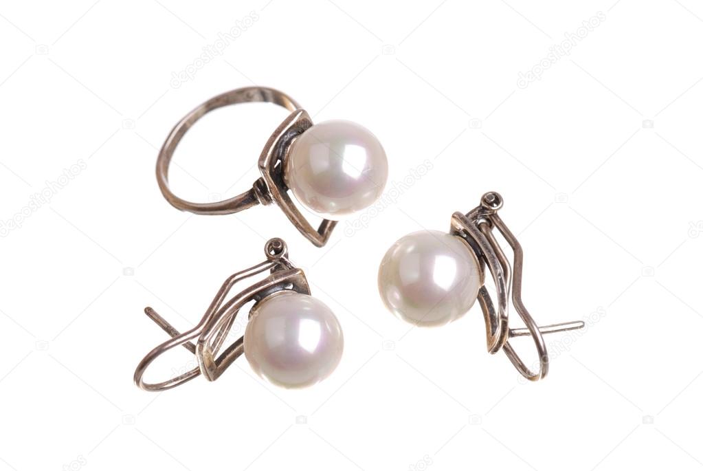 The earrings and ring with a pearl