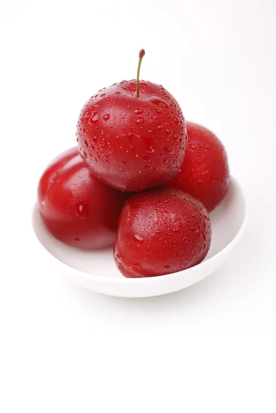 Ripe and juicy plums on white — Stock Photo, Image