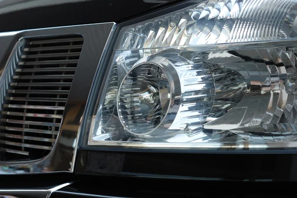 Forward headlight of the black car — Stock Photo, Image