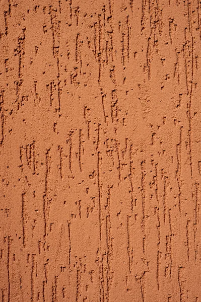 Red striated stucco wall texture — Stock Photo, Image