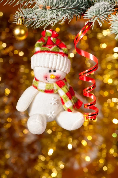 Christmas snowman on fir tree branch — Stock Photo, Image