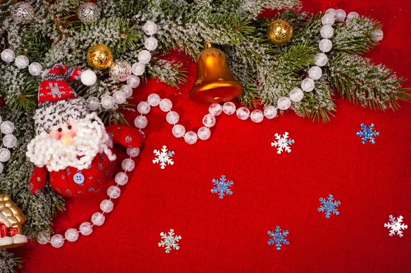 Christmas tree decoration on red sackcloth — Stock Photo, Image
