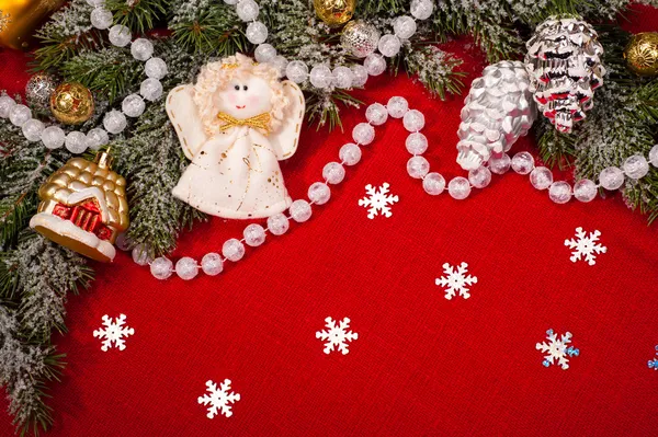 Christmas tree decoration on red sackcloth — Stock Photo, Image
