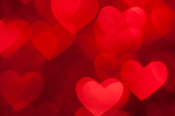 Red bokeh of hearts background — Stock Photo, Image