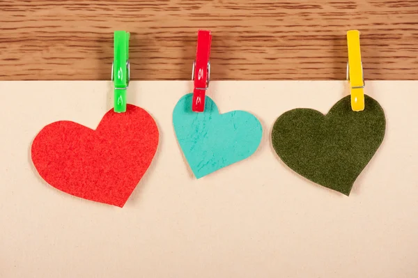 Card with hearts on wooden background — Stock Photo, Image