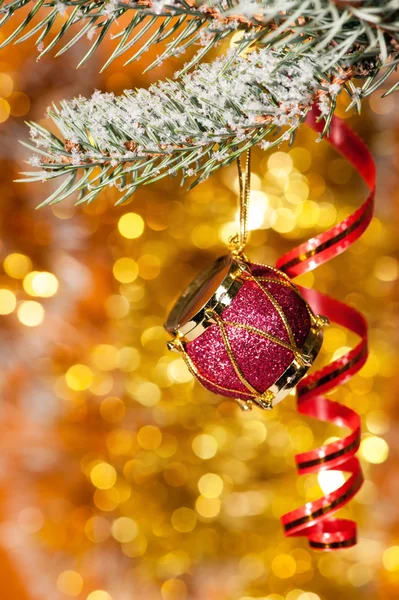 Christmas drum on fir tree branch — Stock Photo, Image