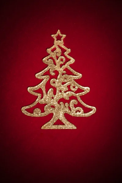 Albero d'oro di Natale sul rosso — Foto Stock