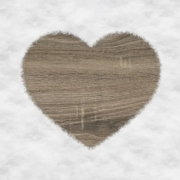 Heart shape made of wood and snow — Stock Photo, Image