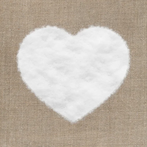 Σχήμα καρδιάς από κλωστοϋφαντουργικά και χιόνι — Φωτογραφία Αρχείου