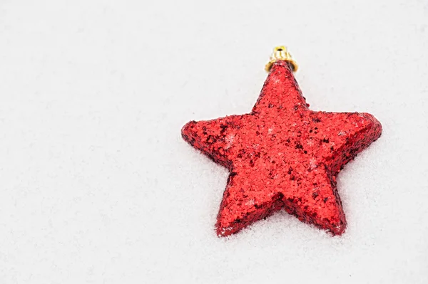 Star on snow background — Stock Photo, Image