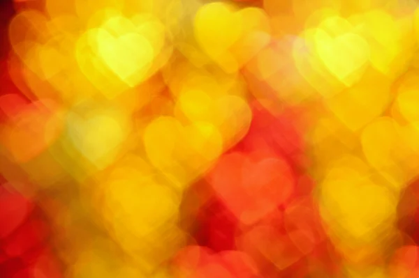 red and golden hearts background