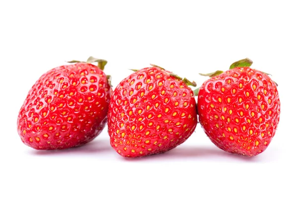 Trois fraises sur blanc — Photo