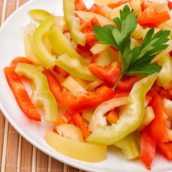 Sliced pepper and parsley — Stock Photo, Image