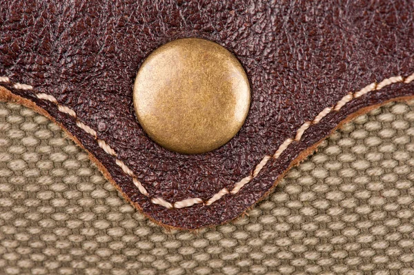 Rivet on leather and fabric — Stock Photo, Image