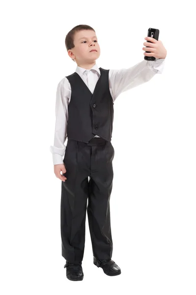 Niño en traje con teléfono —  Fotos de Stock