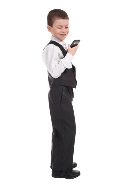 Niño en traje con teléfono — Foto de Stock