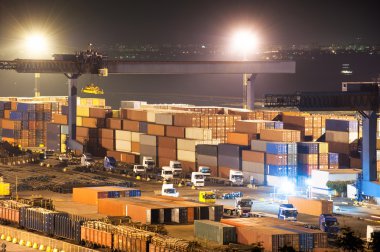 Containers in port at night clipart