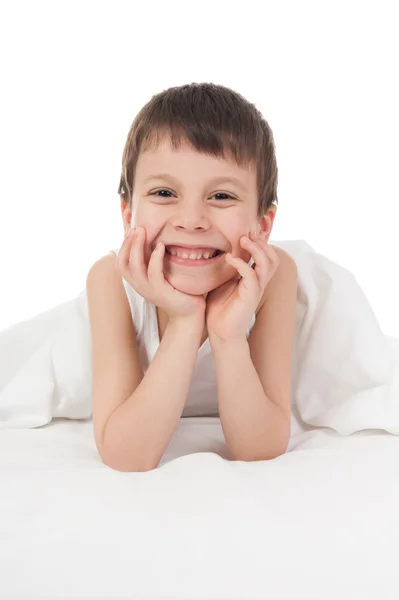 Niño alegre en la cama —  Fotos de Stock