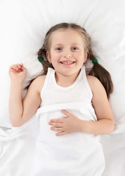 Veselá holka v posteli — Stock fotografie