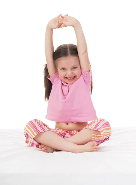 Glad tjej i sängen — Stockfoto