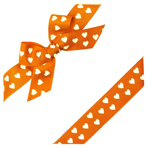 Orange bow with hearts and ribbon — Stock Photo, Image