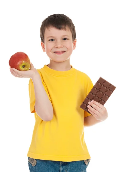 Boy with apple and chocolate — Stock Photo, Image